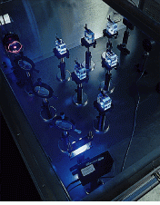 FIGURE 1. Fused silica samples are irradiated with an argon fluoride excimer laser beam to evaluate performance in 193-nm lithographic systems. Visible fluorescence is indicative of the absorption of 193-nm radiation, though the correlation between the two is not straightforward.