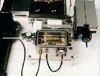 Prototype tiny time-of-flight mass spectrometer is part of a program to produce a highly sensitive, field-portable system capable of biological sensing.