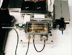 Prototype tiny time-of-flight mass spectrometer is part of a program to produce a highly sensitive, field-portable system capable of biological sensing. Prototype tiny time-of-flight mass spectrometer is part of a program to produce a highly sensitive, field-portable system capable of biological sensing.