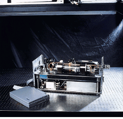 FIGURE 1. Compact laser-based gas sensor contains Nd:YAG laser, diode laser, and periodically poled lithium niobate in package measuring only 1 &times; 1 &times; 2 ft. Difference-frequency generation produces 4.6-&micro;m radiation that was used in field tests in which this instrument was capable of monitoring CO concentrations at the parts-per-billion level.