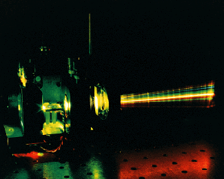 Diode-pumped high-gain oscillator for pumping an intracavity periodically poled lithium niobate OPO can stimulate a nearly continuous spread of wavelengths across the 1500- to 5000-nm spectrum, which is made visible above by frequency-doubling.