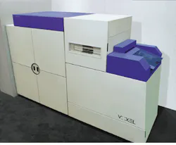 FIGURE 1. Elements of three laboratory rooms, two laser optical systems, and a film-processing room were combined to make the Voxcam, a 3 x 8-ft holographic laser-based camera system used to convert digital data from CT or MR scans into Voxgrams. FIGURE 1. Elements of three laboratory rooms, two laser optical systems, and a film-processing room were combined to make the Voxcam, a 3 x 8-ft holographic laser-based camera system used to convert digital data from CT or MR scans into Voxgrams.