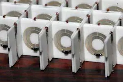 FIGURE 1. Split-ring resonators are shown arranged in a uniformly spaced array in a negative-index metamaterial for microwave frequencies. Optical metamaterials use nanometer-scale elements. FIGURE 1. Split-ring resonators are shown arranged in a uniformly spaced array in a negative-index metamaterial for microwave frequencies. Optical metamaterials use nanometer-scale elements.