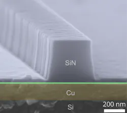 A nanoscale silicon nitride (SiN)-on-copper (Cu) plasmonic waveguide on a silicon (Si) chip is imaged via electron microscopy. A nanoscale silicon nitride (SiN)-on-copper (Cu) plasmonic waveguide on a silicon (Si) chip is imaged via electron microscopy.
