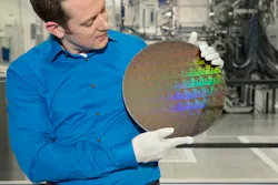 IBM Research scientist Nicolas Loubet holds a wafer of chips with 5nm silicon nanosheet transistors manufactured using an industry-first process that can deliver 40 percent performance enhancement at fixed power, or 75% power savings at matched performance. IBM Research scientist Nicolas Loubet holds a wafer of chips with 5nm silicon nanosheet transistors manufactured using an industry-first process that can deliver 40 percent performance enhancement at fixed power, or 75% power savings at matched performance.