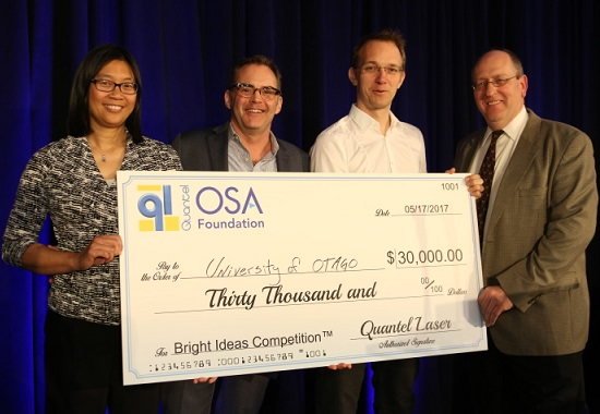 Quantel Laser and the OSA Foundation awarded a check to Harald Schwefel of the University of Otago in New Zealand as the winner of the Bright Ideas Competition for his work in photon-triplet generation for quantum optics and secure communication.