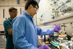 Los Alamos National Laboratory (LANL) Chemist Jaehoon Lim works on an apparatus that synthesizes quantum dots along with LANL researcher Young-Shin Park (also with the University of New Mexico Center for High-Technology Materials). LANL colleagues Kaifeng Wu and Victor Klimov worked with Lim and Park to demonstrate that negatively charged quantum dots show promise for low-power laser applications or quantum dot laser diodes. Los Alamos National Laboratory (LANL) Chemist Jaehoon Lim works on an apparatus that synthesizes quantum dots along with LANL researcher Young-Shin Park (also with the University of New Mexico Center for High-Technology Materials). LANL colleagues Kaifeng Wu and Victor Klimov worked with Lim and Park to demonstrate that negatively charged quantum dots show promise for low-power laser applications or quantum dot laser diodes.