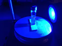 A blue LED shines on a vial containing heavy water, a pharmaceutical compound, and a light-activated catalyst. Princeton chemistry professor David MacMillan and colleagues have developed a new photocatalytic approach to hydrogen isotope exchange (HIE) that turns a multi-month process into a one-day step, speeding the arrival of new drugs to the marketplace. A blue LED shines on a vial containing heavy water, a pharmaceutical compound, and a light-activated catalyst. Princeton chemistry professor David MacMillan and colleagues have developed a new photocatalytic approach to hydrogen isotope exchange (HIE) that turns a multi-month process into a one-day step, speeding the arrival of new drugs to the marketplace.