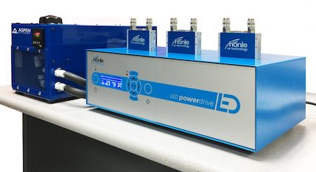 An industrial UV LED light source made by Honle UV (right) is cooled using a chiller produced by Aspen Systems (left).