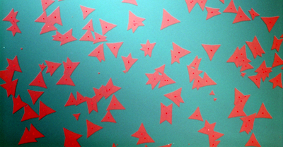 Photomicrograph shows two-dimensional crystals of the thin-film semiconductor molybdenum disulfide.