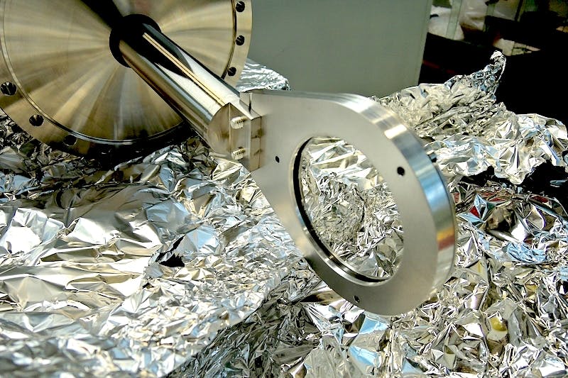 Plano convex lens being installed.