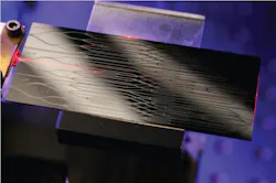 FIGURE 2. An integrated optics beam combiner system being used at the CHARA array is a few centimeters across and able to combine four telescope beams using single-mode fibers in a space previously used by an instrument the size of a large optical table. FIGURE 2. An integrated optics beam combiner system being used at the CHARA array is a few centimeters across and able to combine four telescope beams using single-mode fibers in a space previously used by an instrument the size of a large optical table.