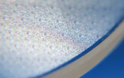 FIGURE 2. In addition to refractive micro-optic elements, the etching technique also produces diffractive micro-optic elements. FIGURE 2. In addition to refractive micro-optic elements, the etching technique also produces diffractive micro-optic elements.