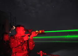 FIGURE 1. Troops test-fire optical distractors on the aircraft carrier USS Abraham Lincoln. Note how the beams spread rapidly, reducing the nominal ocular hazard distance and spreading the beam over a wider area on targets. FIGURE 1. Troops test-fire optical distractors on the aircraft carrier USS Abraham Lincoln. Note how the beams spread rapidly, reducing the nominal ocular hazard distance and spreading the beam over a wider area on targets.