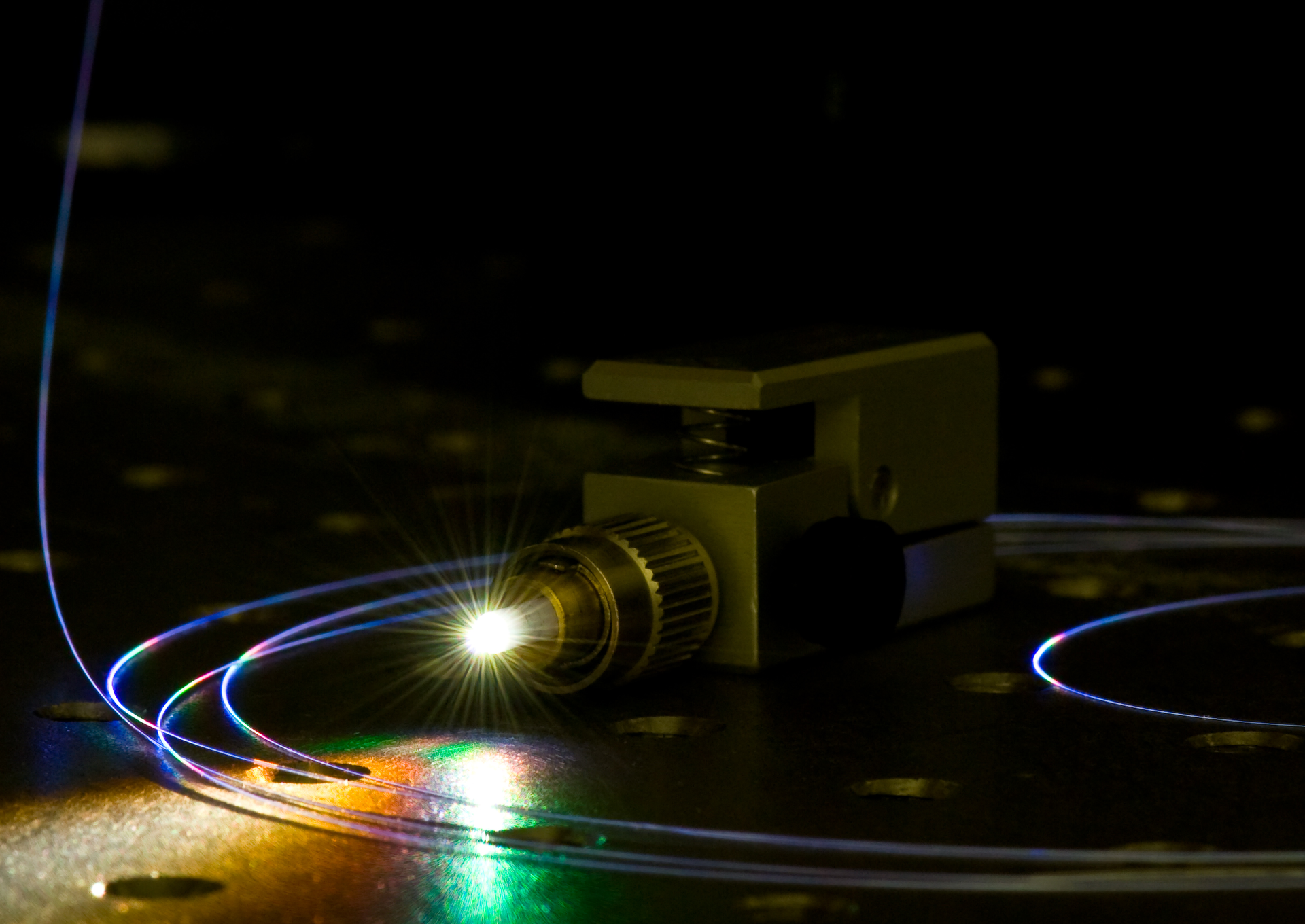 A light source unlike either lasers or LEDs, supercontinuum light emerges from a photonic crystal fiber.