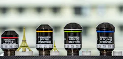 Using a 2PP 3D printer, four polymer models of the Eiffel Tower with sizes of (from left to right) 40, 15, 3, and 0.2 mm in size were printed; each printed part is shown next to the objective used to print it. Printing times for the parts from left to right were 8h 49m, 1h 29m, 37m, and 27m respectively. Using a 2PP 3D printer, four polymer models of the Eiffel Tower with sizes of (from left to right) 40, 15, 3, and 0.2 mm in size were printed; each printed part is shown next to the objective used to print it. Printing times for the parts from left to right were 8h 49m, 1h 29m, 37m, and 27m respectively.