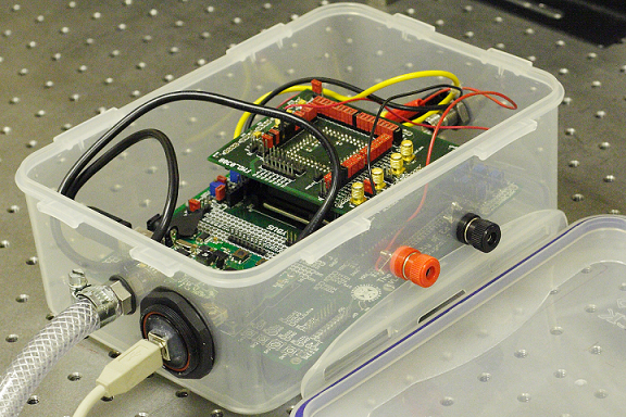 A lunchbox-sized (20 &times; 13 &times; 7 cm3) explosive-vapor-detection system measures fluorescent photoluminescence decay from a thin-film photoemissive polymer material using a CMOS-based detection system.