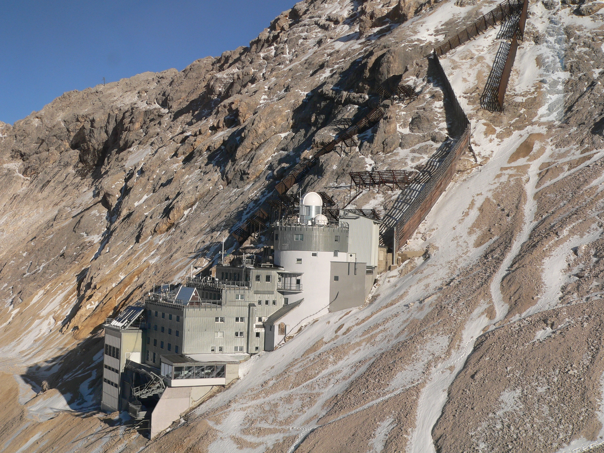A high-power DIAL system is sited at the Environmental Research Station Schneefernerhaus on Germany&rsquo;s Zugspitze, above most of the atmosphere&rsquo;s lower-level moisture. Backscattered light from the DIAL collected by a Newtonian telescope (in the laboratory below the white domes) provides information on the vertical water-vapor distribution in the free troposphere.