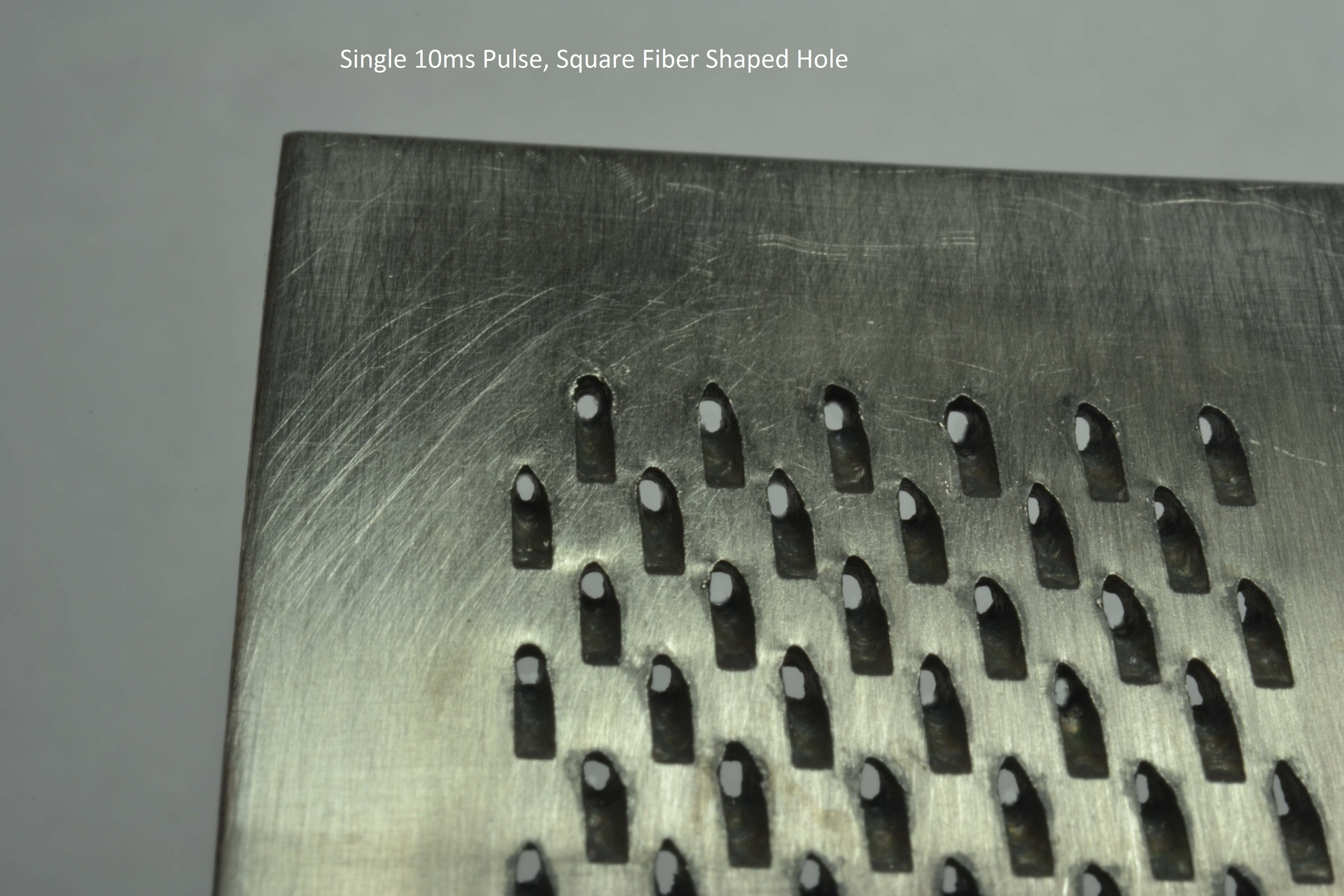 FRONTIS. In aerospace component drilling tests, a single 10 ms pulse from a square output fiber laser can produce a large square entrance hole at focus.