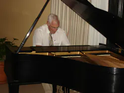 Angus playing piano at the Topical Meeting on Optical Interference Coatings, Tucson, 2007. Angus playing piano at the Topical Meeting on Optical Interference Coatings, Tucson, 2007.