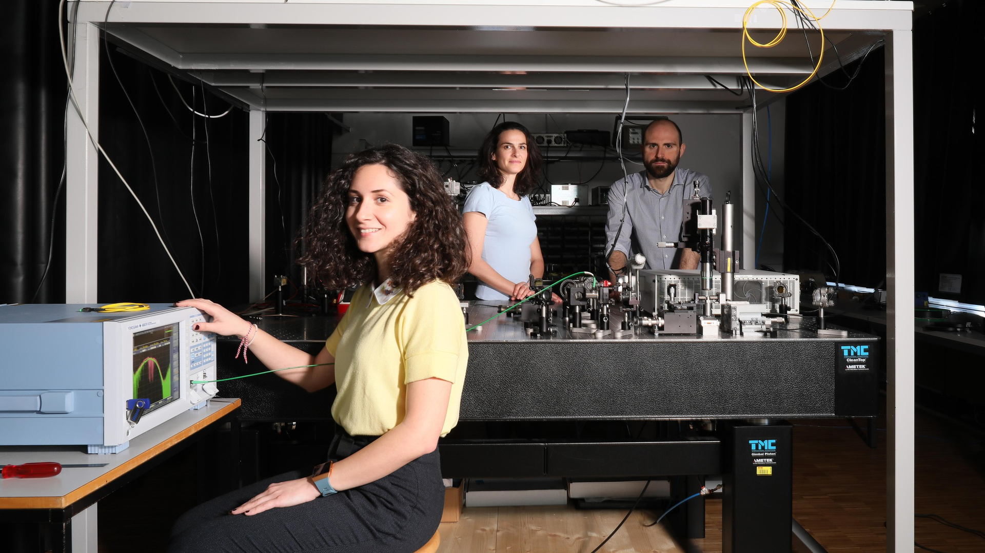 Eirini Tagkoudi, Camiile Br&egrave;s, and Davide Grassani test their mid-IR supercontinuum light source.