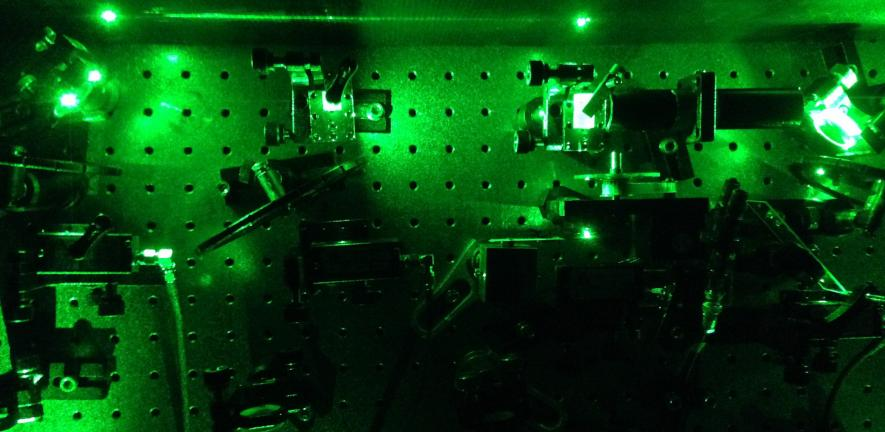An image from an experiment in the quantum optics laboratory at the University of Cambridge demonstrates how laser light was used to excite artificially constructed atoms known as quantum dots to create the &ldquo;squeezed&rdquo; single photons.