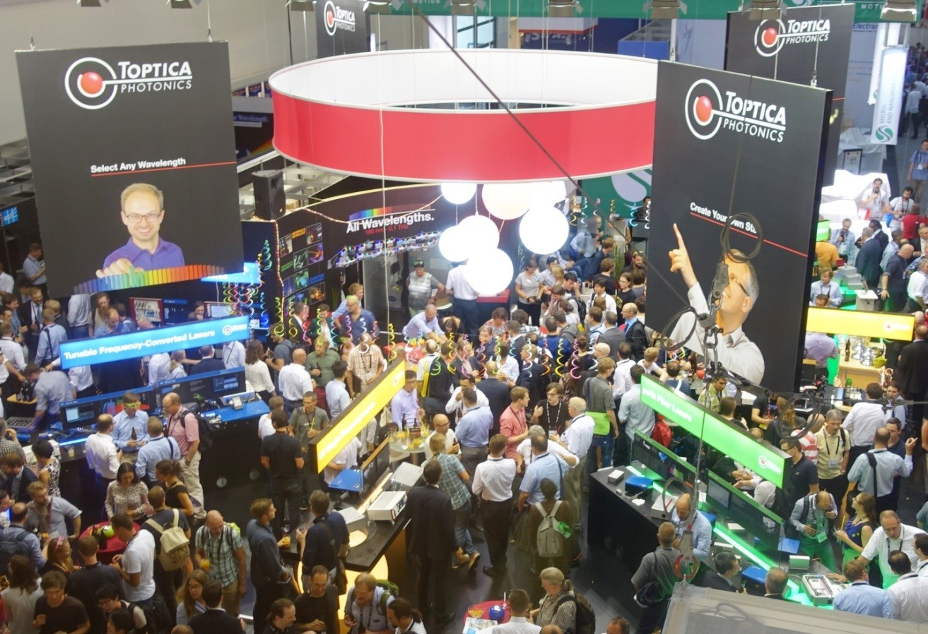 FIGURE 1. Not an insider tip anymore&mdash;the Toptica booth party is traditionally the best at the LASER fair.