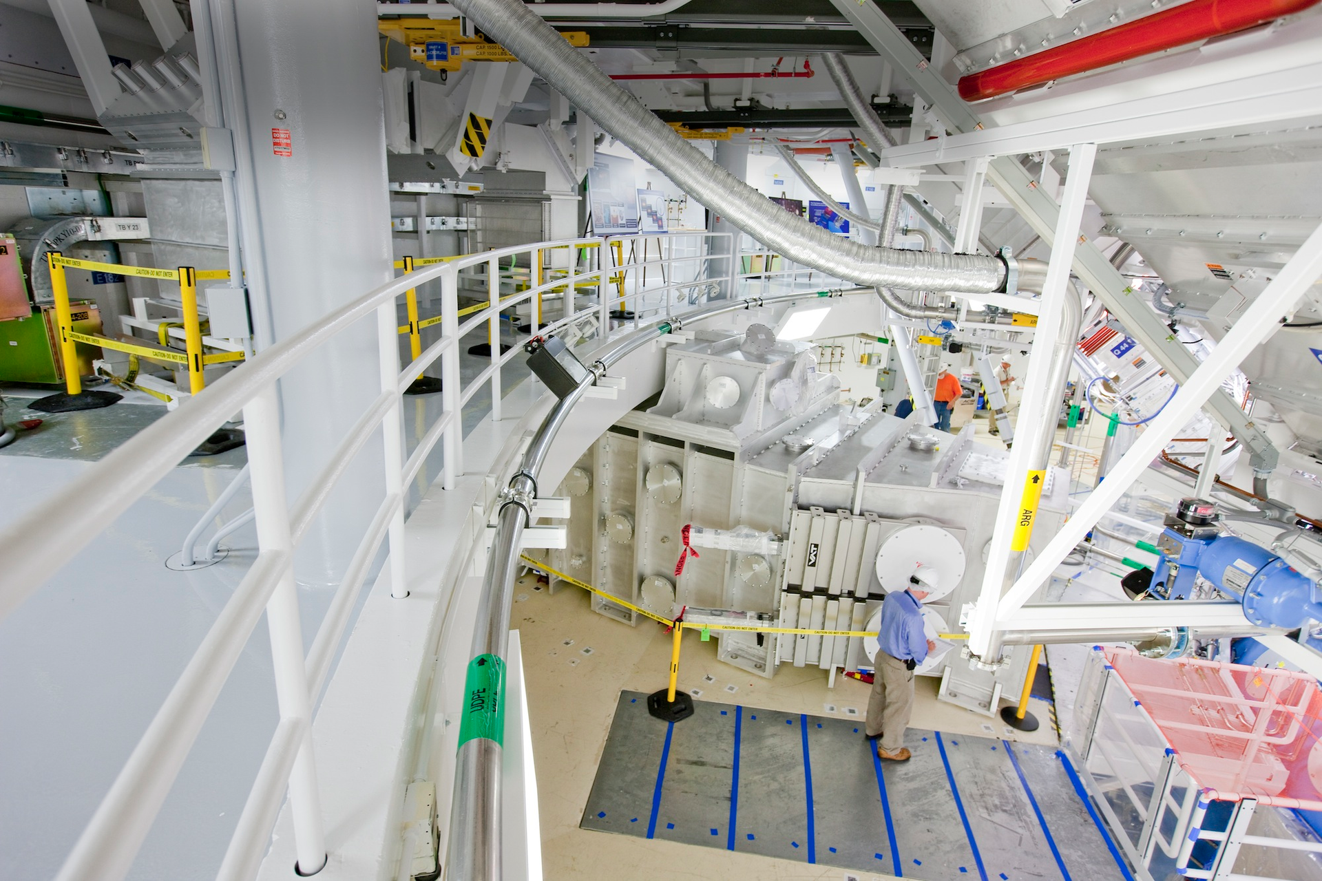 A high-energy petawatt laser, the Advanced Radiographic Capability (ARC), will conduct multiframe, hard-X-ray radiography of imploding NIF capsules. The short pulses for ARC will be produced by compressing the laser pulse, with gratings in the large ARC compression chamber shown in the photo.