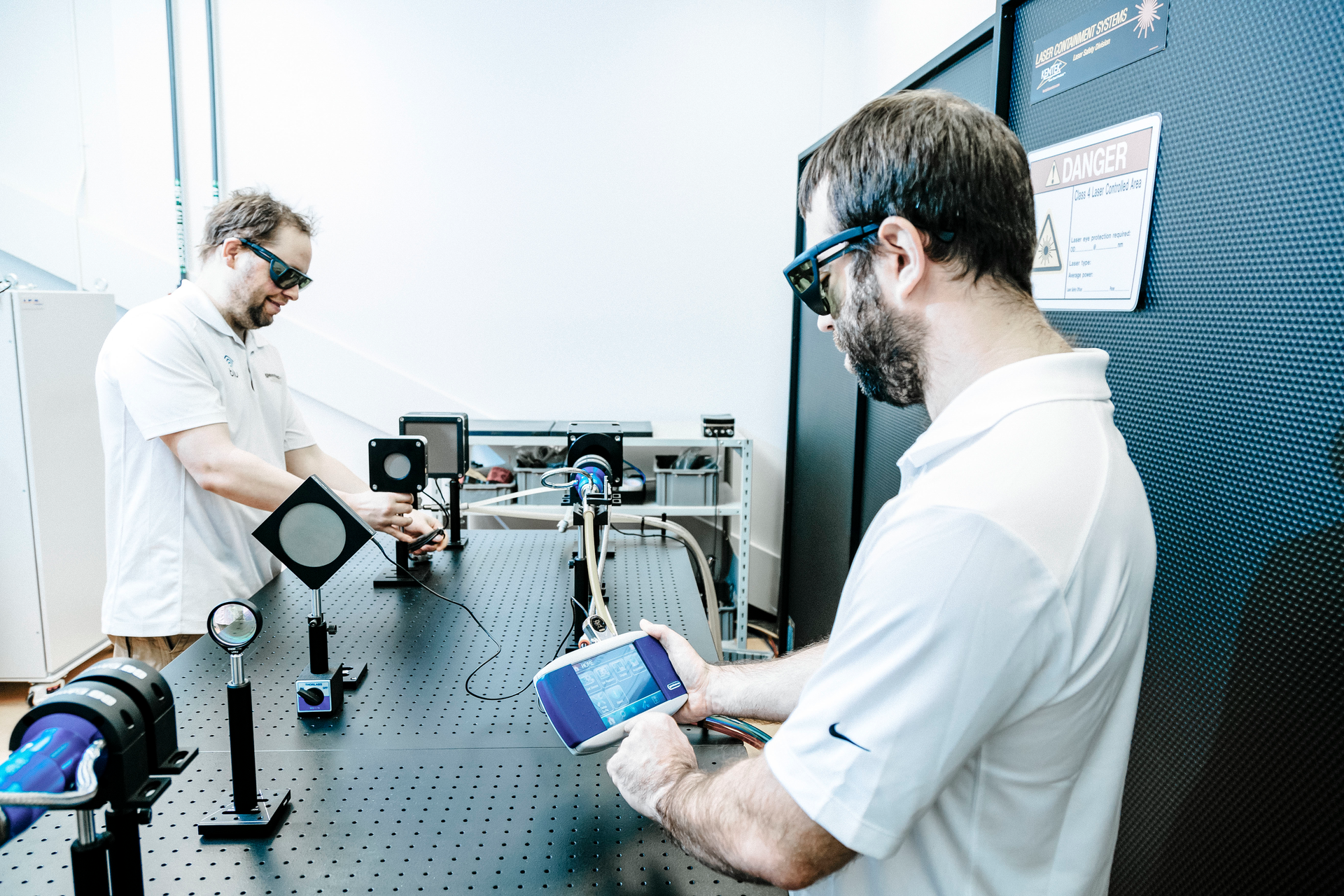 FIGURE 1. Measuring optical power output is key; shown here are laser technicians measuring that of a kilowatt-level fiber laser using Gentec-EO&rsquo;s MAESTRO power and energy meter.
