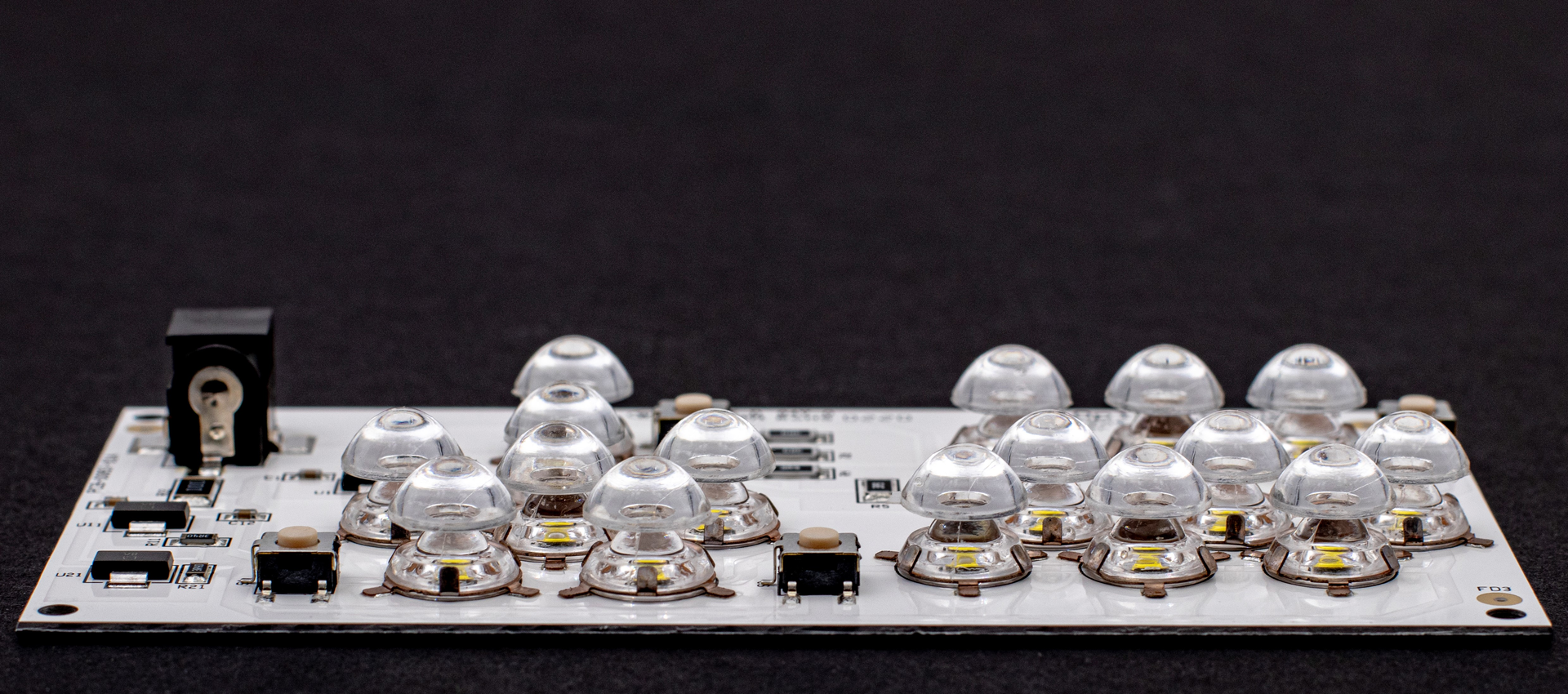 FIGURE 1. Surface-mount optics (SMOs) on an LED circuit board.