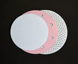 FIGURE 2. Three abrasive discs illustrate the progression from no holes, to 10mm-diameter holes, to high-density, 1.5mm-diameter micro-holes for dust extraction. FIGURE 2. Three abrasive discs illustrate the progression from no holes, to 10mm-diameter holes, to high-density, 1.5mm-diameter micro-holes for dust extraction.