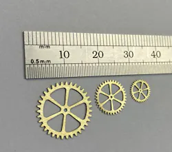 FIGURE 2. Erosion-cut micro gears from 0.35 mm brass. FIGURE 2. Erosion-cut micro gears from 0.35 mm brass.