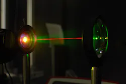 A laser beam is used in the lab to test the gold-hyperdoped sample of silicon to confirm its infrared-sensitive properties. A laser beam is used in the lab to test the gold-hyperdoped sample of silicon to confirm its infrared-sensitive properties.