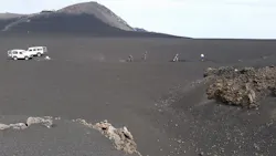 FIGURE 1. Researchers dig the trench for the fiber-optic cable at the site of Mount Etna (2800 m elevation, Piano delle Concazze; the Pizzi Deneri Observatory can be seen in the background. FIGURE 1. Researchers dig the trench for the fiber-optic cable at the site of Mount Etna (2800 m elevation, Piano delle Concazze; the Pizzi Deneri Observatory can be seen in the background.