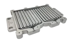 FIGURE 3. Cut section of an optimized liquid-cooled heat exchanger printed without supports on 3D Systems’ DMP Flex 350 Dual using LaserForm AlSi7Mg0.6 (A) material. This saves 83% space and eliminates 97 parts compared to a conventional air-cooled heat sink. FIGURE 3. Cut section of an optimized liquid-cooled heat exchanger printed without supports on 3D Systems’ DMP Flex 350 Dual using LaserForm AlSi7Mg0.6 (A) material. This saves 83% space and eliminates 97 parts compared to a conventional air-cooled heat sink.