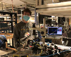 FIGURE 2. Mateus Corato-Zanarella in the lab coupling light from a blue laser diode to a photonic chip. FIGURE 2. Mateus Corato-Zanarella in the lab coupling light from a blue laser diode to a photonic chip.