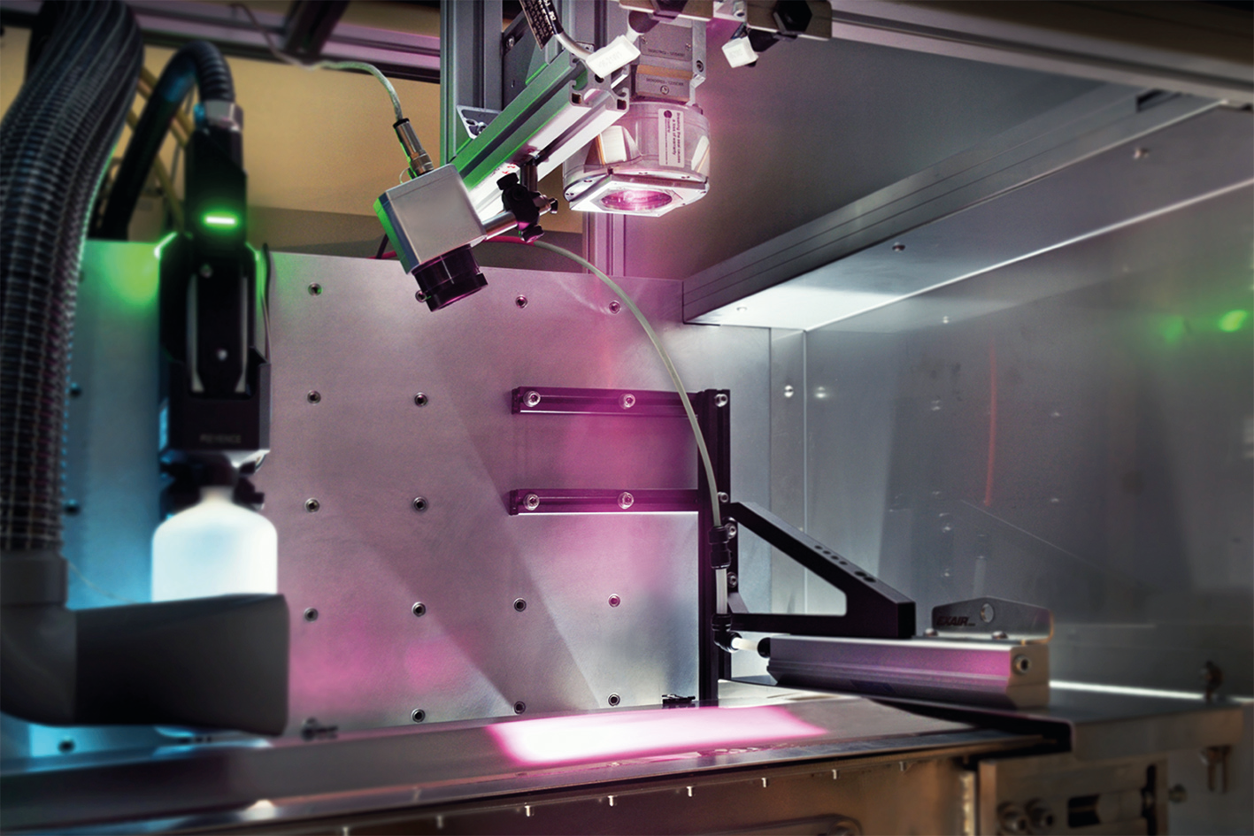 Using custom optics, the laser radiates a larger area on the copper foil coated with graphite paste. The interaction between the graphite particles and the light energy generates heat and the liquid evaporates.