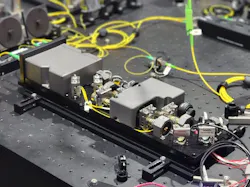 QU-SOURCE leverages a spontaneous four-wave mixing (SFWM) within an atomic vapor (rubidium) to produce highly pure polarization-entangled photon pairs. QU-SOURCE leverages a spontaneous four-wave mixing (SFWM) within an atomic vapor (rubidium) to produce highly pure polarization-entangled photon pairs.