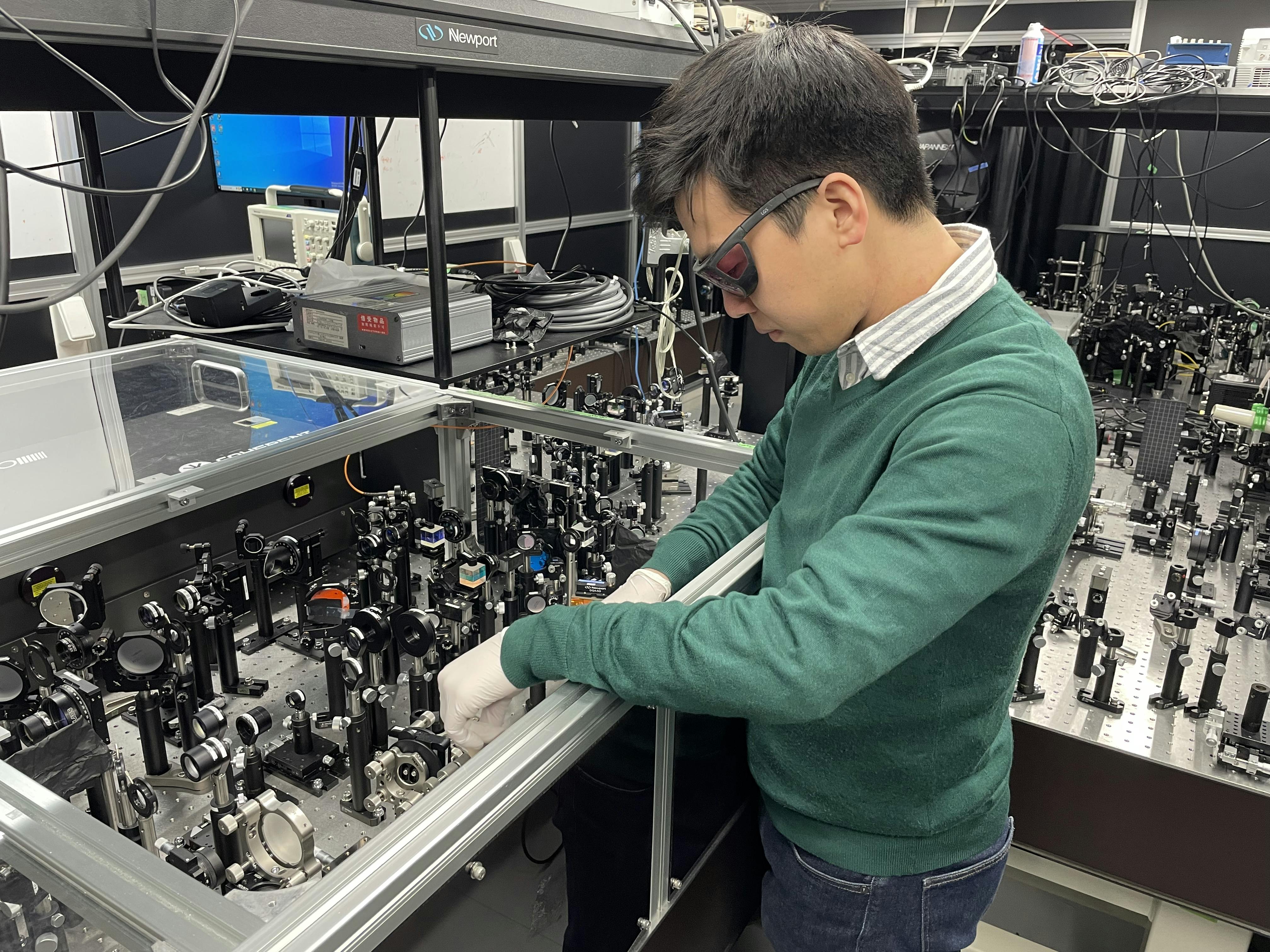 FIGURE 1. Keitaro Shimada working on an ultrafast imaging system using the spectrum shuttle.