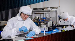 FIGURE 1. Vescent’s team in the cleanroom assembling frequency combs. FIGURE 1. Vescent’s team in the cleanroom assembling frequency combs.