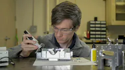 The cold, continuous atomic source used in the U.S. Naval Research Laboratory’s continuous dual-beam interferometer program requires stable and well-aligned beams to cool and aim the atomic beam. In this photo, Jonathan Kwolek assembles the custom optical system to generate and aim each of the laser beams, which represents the first of multiple miniaturization efforts for compact and stable laser delivery in the NRL Atom Interferometry Lab. The cold, continuous atomic source used in the U.S. Naval Research Laboratory’s continuous dual-beam interferometer program requires stable and well-aligned beams to cool and aim the atomic beam. In this photo, Jonathan Kwolek assembles the custom optical system to generate and aim each of the laser beams, which represents the first of multiple miniaturization efforts for compact and stable laser delivery in the NRL Atom Interferometry Lab.