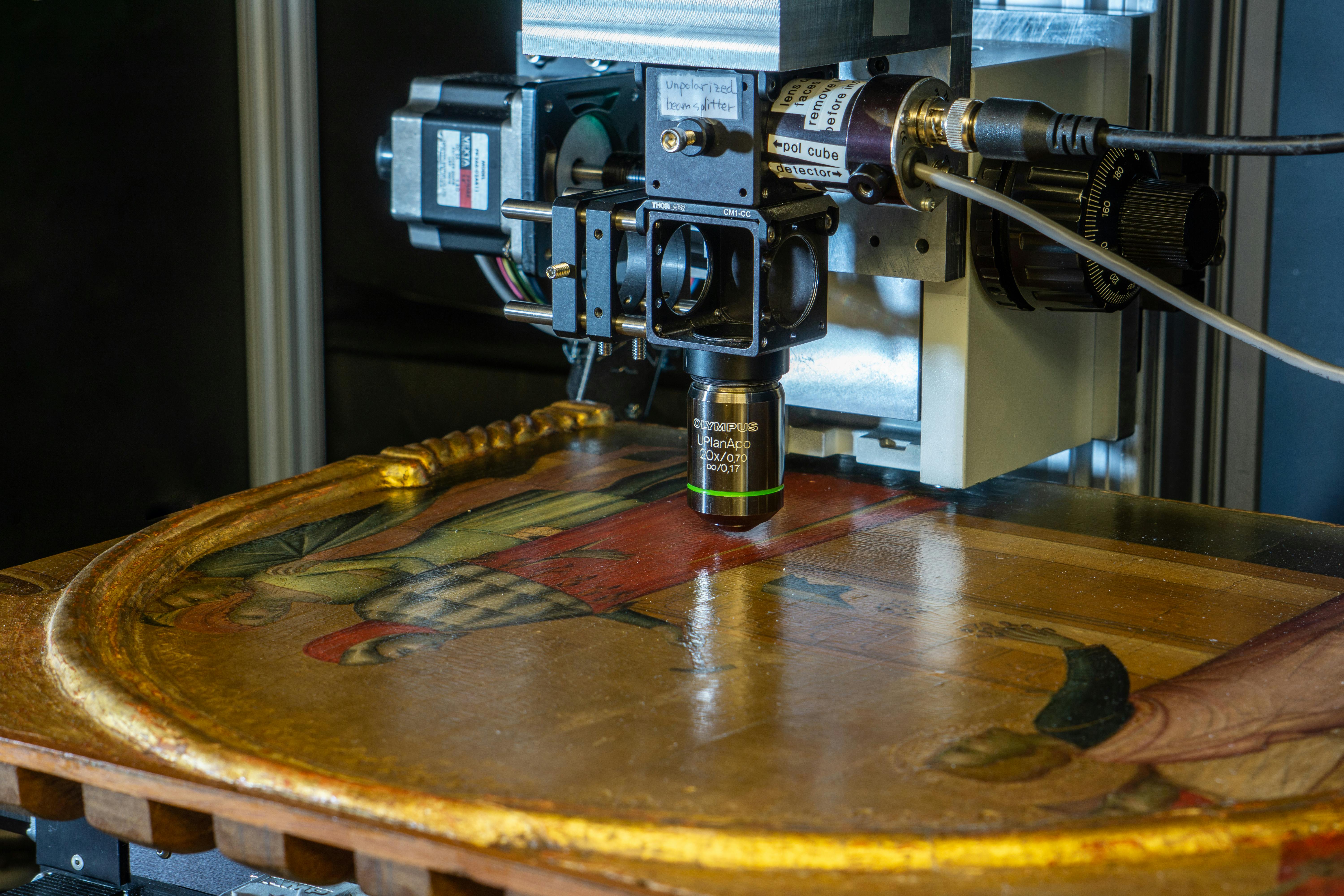 Researchers used their pump-probe microscopy technique to analyze a panel of &ldquo;St. John the Evangelist Reproving the Philosopher Crato&rdquo; of the Ghissi Altarpiece that&rsquo;s on display in the North Carolina Museum of Art. The painting is part of the distributed Samuel H. Kress collection.