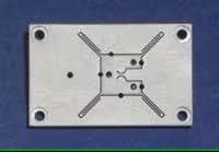 FIGURE 1. A high-speed, high-precision rotational stage is formed from a single piece of aluminum. The rotational platform (center) is attached to the outer frame by flexure hinges that are formed by electric-discharge machining.
