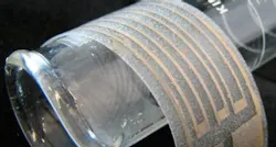 Non-particle-based silver ink is airbrushed onto a plastic film to make a flexible silver electrode. Non-particle-based silver ink is airbrushed onto a plastic film to make a flexible silver electrode.