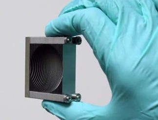 An array of stacked plates forms a lens that focuses terahertz radiation.