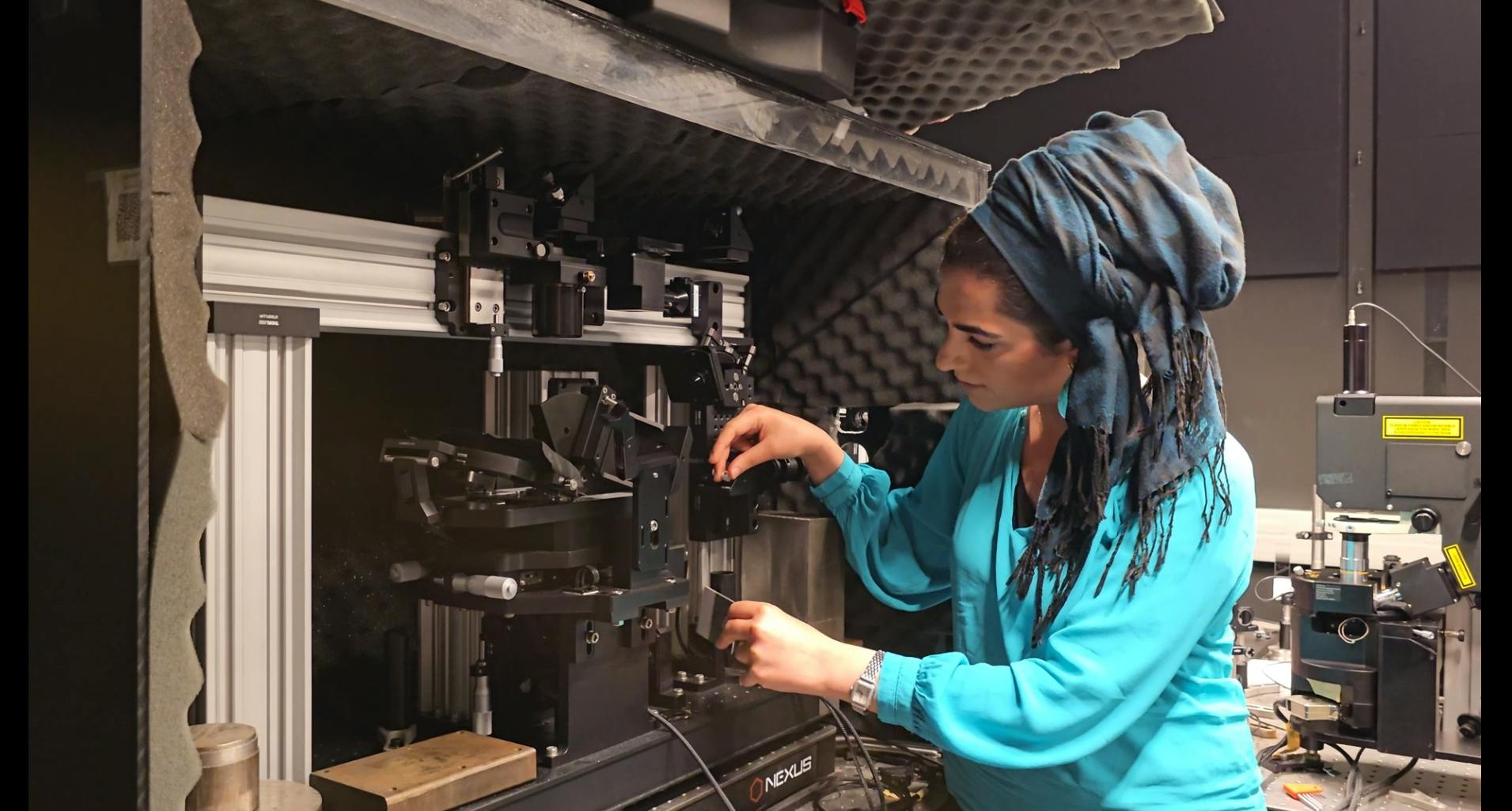 Natalie Fardian-Melamed in the lab working on a combo scanning probe&mdash;an inverted-optical microscope to explore single photon avalanching nanocrystal mechano-optics and photophysics. (Photo credit: William P.D. Hayes/Columbia Engineering)