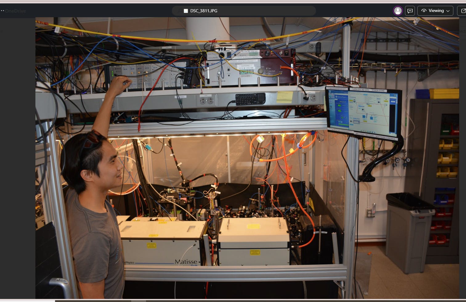 In Hutzler's laboratory at Caltech, the Matisse Ti:sapphire laser, coupled with the Mixtrain SFG system, performs spectroscopy and laser control of cold atoms and molecules used to search for new fundamental particles and forces. Above, a graduate student adjusts locking electronics on the IR Ti:sapphire seed to excite an optical transition to a metastable triplet state of neutral radium-226 atoms, which induces accelerated formation of new radium-containing molecules.