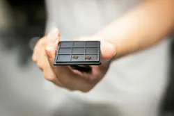 FIGURE 2. The team’s patterned aluminum gallium arsenide photonic crystal. Credit: Eric Sucar/University of Pennsylvania FIGURE 2. The team’s patterned aluminum gallium arsenide photonic crystal. Credit: Eric Sucar/University of Pennsylvania