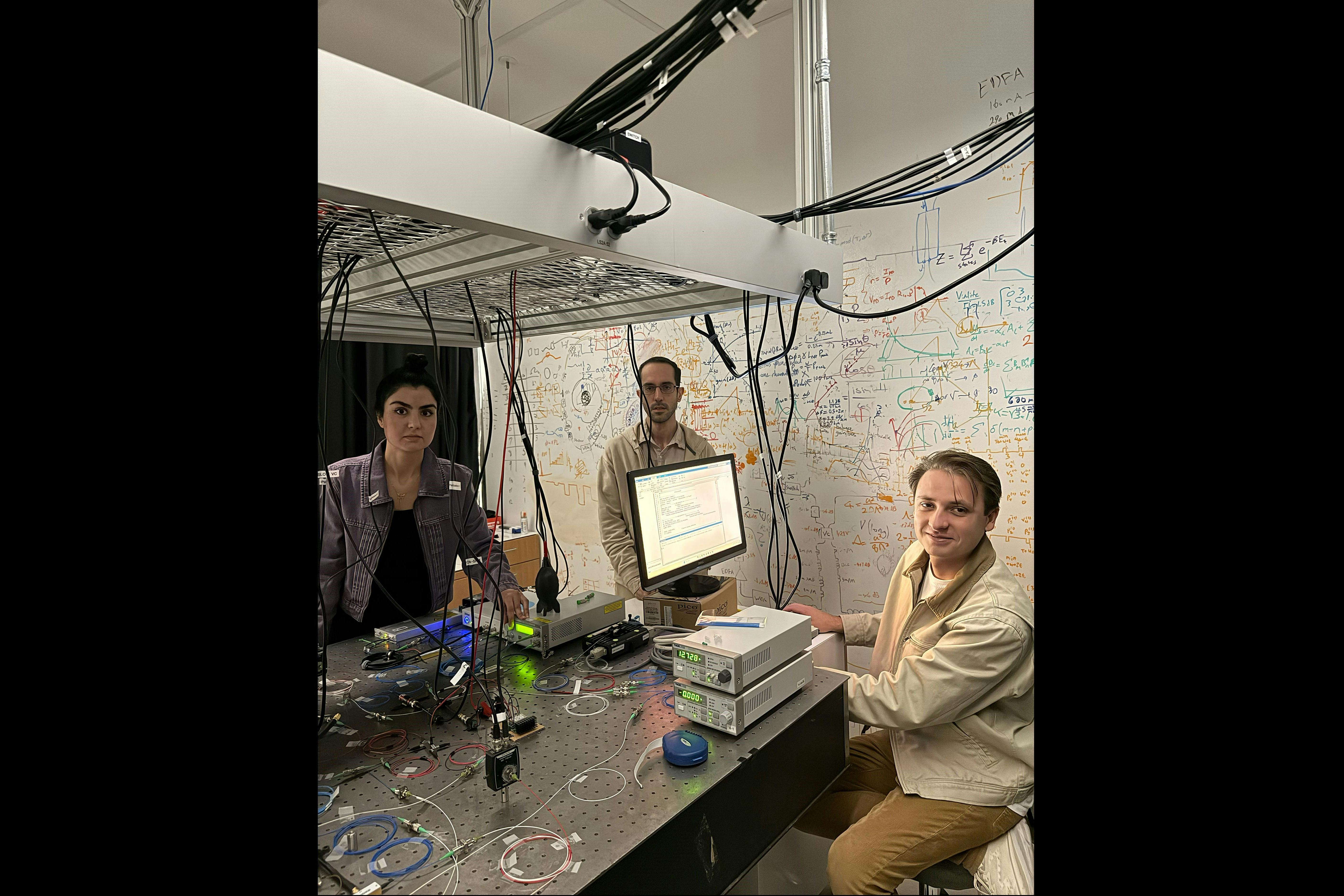(L-R) Hediyeh M. Dinani, Dr. Georgios Pyrialakos, and Abraham M. Berman Bradley in the lab with their setup. Credit: Khajavikhan&rsquo;s Group