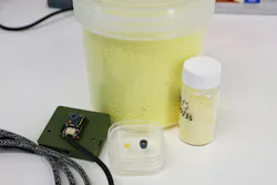 Thermal imaging camera equipped with the Flinders polymer lens (left), with the polymer lens and a custom mount (middle), and reagents to make the polymer (right/rear). Thermal imaging camera equipped with the Flinders polymer lens (left), with the polymer lens and a custom mount (middle), and reagents to make the polymer (right/rear).